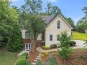 Charming two-story home featuring a lush landscaped front yard and inviting entryway at 5923 Rosie Se Ln, Mableton, GA 30126