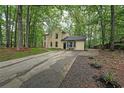 Two-story home featuring a long driveway and a well-maintained front yard at 7156 Whitfield Drive Dr, Riverdale, GA 30296