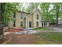 Two-story home with a well-manicured lawn and a cozy front entrance at 7156 Whitfield Drive Dr, Riverdale, GA 30296