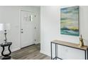 Bright foyer with hard surface floors, white walls, console table, and modern lamp at 2485 Hillside Ave, Decatur, GA 30032