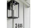 Close up of the number 2485 next to a porch light at the front of a home at 2485 Hillside Ave, Decatur, GA 30032