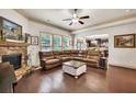 Spacious living room with a stone fireplace, hardwood floors, and ample seating, perfect for entertaining at 2525 Well Springs Dr, Buford, GA 30519