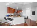 Eat-in kitchen featuring a breakfast bar, sleek counter tops and modern stainless steel appliances at 711 Cosmopolitan Ne Dr # 625, Atlanta, GA 30324