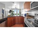 This kitchen boasts granite countertops, modern stainless steel appliances, and ample wood cabinetry at 711 Cosmopolitan Ne Dr # 625, Atlanta, GA 30324