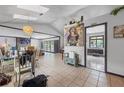 Bright and airy living room with stone fireplace, skylights, and tile floors perfect for entertaining at 962 Brighton Dr, Lawrenceville, GA 30043