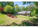 Charming one story home with a well-manicured lawn and mature trees in a tranquil setting at 170 Mayfield Cir, Alpharetta, GA 30009