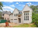 Beautiful two-story home with painted brick and hardiplank siding and a three-car garage at 2991 Surrey Ln, Atlanta, GA 30341