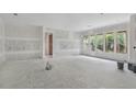 Unfinished living room with large windows allowing ample natural light in the home at 2991 Surrey Ln, Atlanta, GA 30341