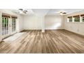 Spacious living room showcasing hardwood floors and French doors at 2784 Williamsburg Way, Decatur, GA 30034