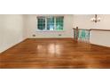 Spacious living room with hardwood floors and natural light from large windows at 2784 Williamsburg Way, Decatur, GA 30034