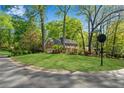 Well-manicured lawn of a lovely brick home at the corner of Johnson Ferry Road at 3402 Johnson Ferry Rd, Roswell, GA 30075