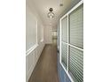 Inviting entryway with hardwood floors and stylish light fixture at 4450 Richmond Ct, Stone Mountain, GA 30083