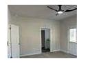 The bedroom of the home has grey carpet with white walls and a ceiling fan at 5381 Tolar Rd, South Fulton, GA 30213