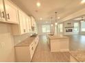 Modern kitchen with granite countertops, stainless steel appliances, and an open layout at 1923 Westfall Lndg, Auburn, GA 30011