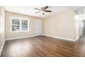 Spacious living room with sleek wood floors, a ceiling fan, and plenty of natural light at 2912 Springside Se, Atlanta, GA 30354