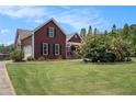 Well-maintained front yard showcases a beautiful, two-story home with a side-entry garage at 1951 Chambers Rd, Mcdonough, GA 30253