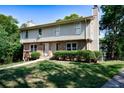 Inviting townhouse with a well-manicured lawn and lush greenery offering a serene setting at 1215 Willow Creek Nw Ct, Conyers, GA 30012