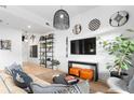 Modern living room features stylish decor, plants, and plenty of natural light at 567 Ponce De Leon Ne Ave # 321, Atlanta, GA 30308