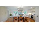Bright, eat-in kitchen featuring a large island, stainless appliances and sleek white cabinetry at 1850 Donald Dr, Marietta, GA 30062