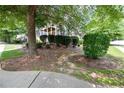 A mature tree adds character to the front yard of this home at 65 Orchard Dr, Covington, GA 30014