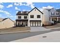 Attractive two-story house with a two car garage and pleasing curb appeal, set in a modern neighborhood at 1590 Branthaven Ln, Auburn, GA 30011