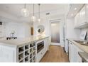 Well-equipped kitchen featuring stone countertops, wine rack, and modern stainless appliances at 1820 Peachtree Nw St # 303, Atlanta, GA 30309