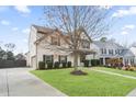 Beautiful home with a spacious driveway and a well-manicured lawn, perfect for outdoor activities at 203 Creek View Ln, Acworth, GA 30102
