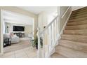 Inviting foyer with tiled floors and a staircase leading to the upper level at 4773 Aberdeen Ln, Stone Mountain, GA 30083