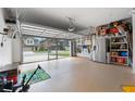 Spacious two-car garage with epoxy floors and ample storage solutions, great for organization at 11684 Stovall Place Pl, Hampton, GA 30228