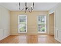 Large living room featuring hardwood floors, crown molding, and neutral paint at 1338 Nonie Way, Marietta, GA 30062