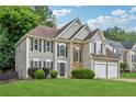 Attractive two-story home with stone accents, a manicured lawn, and a convenient two-car garage at 3015 Cranbrook Nw Walk, Kennesaw, GA 30144