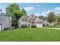 Beautiful two-story home featuring stone accents, a well-kept lawn, and a practical two-car garage at 3015 Cranbrook Nw Walk, Kennesaw, GA 30144