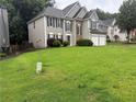 Charming two-story home with neutral siding, stone accents, and an attached two car garage at 3015 Cranbrook Nw Walk, Kennesaw, GA 30144