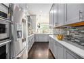 Modern kitchen with stainless steel appliances, sleek cabinets, and stylish backsplash at 1216 Virginia Ne Ct # 8, Atlanta, GA 30306