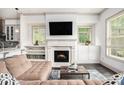 Cozy living room featuring a fireplace, built-in shelves, and ample natural light at 1216 Virginia Ne Ct # 8, Atlanta, GA 30306