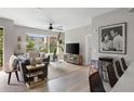 Living room boasts natural light with modern decor and views from large windows at 22 Airline Ne St # 201, Atlanta, GA 30312