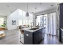 Open kitchen with a center island, bar stool seating, and stainless steel appliances at 399 Pratt Se Dr, Atlanta, GA 30315