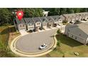 Neighborhood view of similar-style homes, showcasing the community layout and street design at 1825 Villageside Ct, Lawrenceville, GA 30043