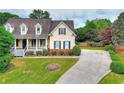 Beautiful two-story house with well-maintained lawn and long driveway at 2726 Riderwood Ne Ln, Marietta, GA 30062