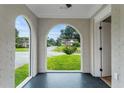 Sunroom with arched windows providing natural light and views of the surrounding neighborhood at 1283 Beecher Sw St, Atlanta, GA 30310
