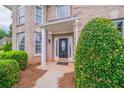 Inviting front porch with a decorative front door and manicured bushes at 157 Hambrick Dr, Stockbridge, GA 30281