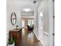 Inviting hallway featuring hardwood floors and leading into a spacious living area at 2630 Timler Trce, Snellville, GA 30078