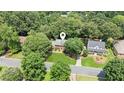 A view of a home with a well-manicured lawn, located in a neighborhood with mature trees at 3267 Remembrance Trce, Lawrenceville, GA 30044