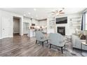 Spacious living room featuring a fireplace, built-in shelving, and an open floor plan at 791 Belrose Dr, Smyrna, GA 30080