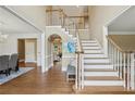 Spacious foyer with hardwood floors, staircase, and views to other rooms at 340 Old York Rd, Johns Creek, GA 30097