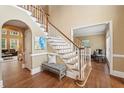 Spacious foyer features hardwood floors, staircase, and bench seating at 340 Old York Rd, Johns Creek, GA 30097