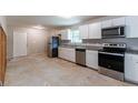Modern kitchen featuring white cabinets, stainless steel appliances, and granite countertops at 6293 Silver Creek Ln, Austell, GA 30168