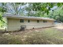 Backyard view, showcasing the home's exterior and mature trees at 1026 Eisenhower Se Ct, Atlanta, GA 30354