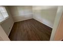 Cozy bedroom with wood-look floors, natural light, and neutral decor at 1026 Eisenhower Se Ct, Atlanta, GA 30354