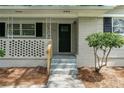 Close-up of front door with a small porch and decorative brickwork at 1026 Eisenhower Se Ct, Atlanta, GA 30354